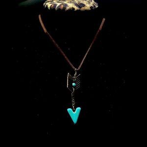 Brown necklace with arrow